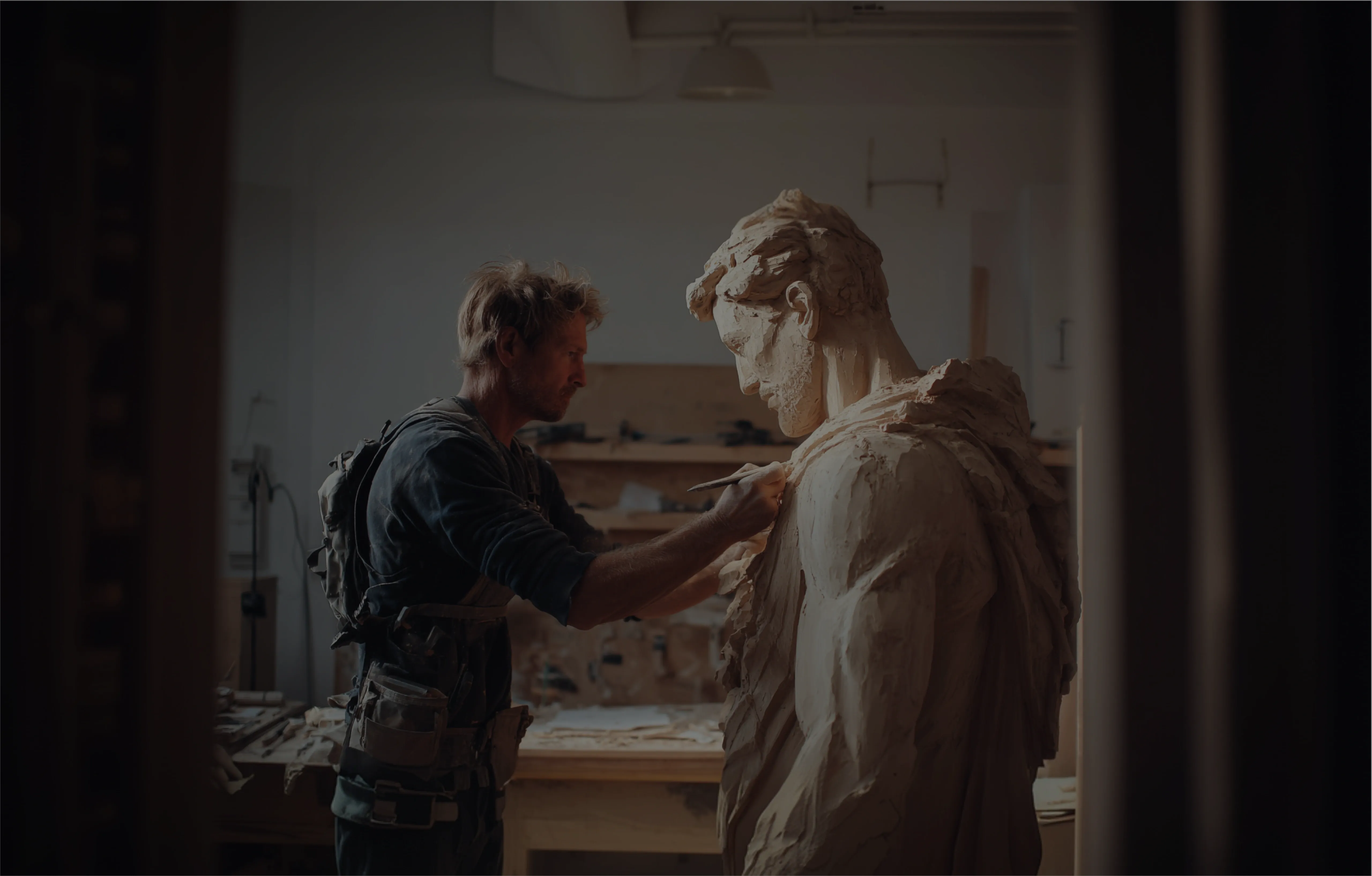 Custom software MVP development Sculptor carving a human statue mid-process – a visual metaphor for custom software MVP development.