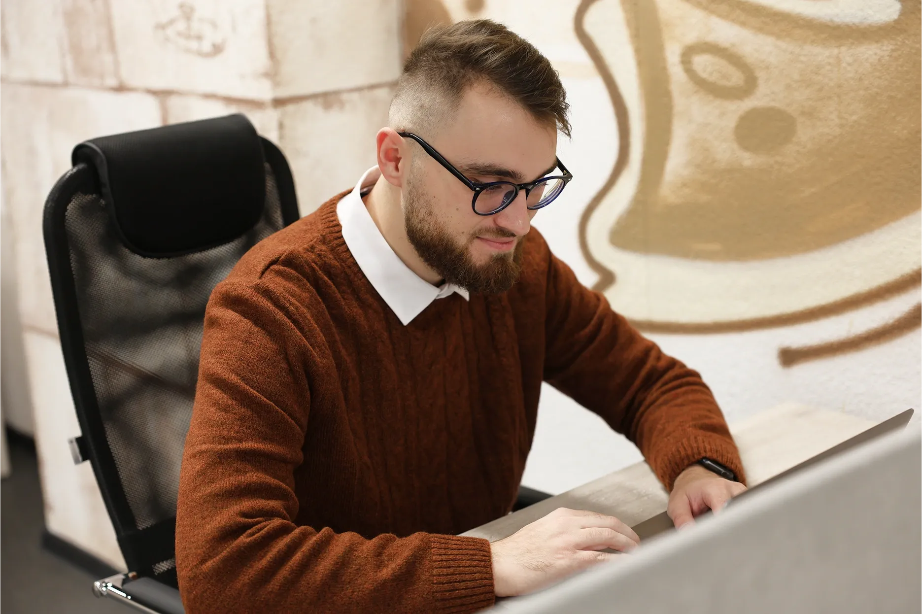 Modsen JavaScript Group Manager Working on a Laptop Modsen JavaScript Group Manager working on a laptop